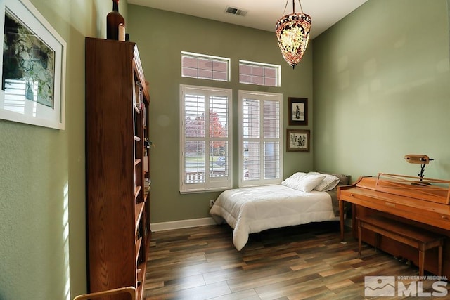 bedroom featuring dark wood-type flooring