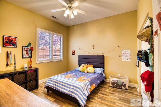 bedroom featuring hardwood / wood-style floors and ceiling fan