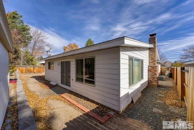 view of property exterior with central AC unit