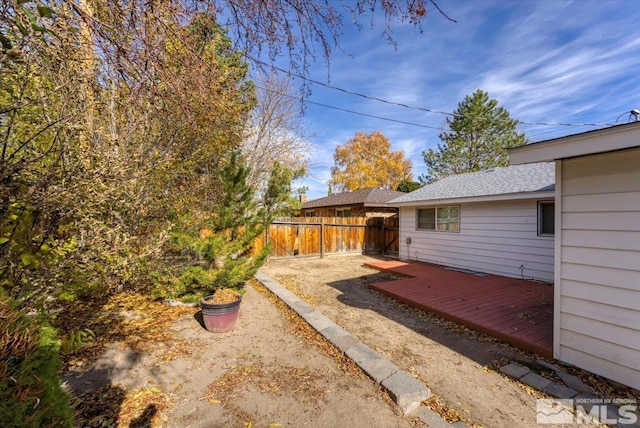 view of yard with a wooden deck