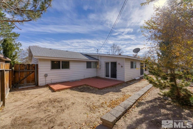 rear view of property with a deck