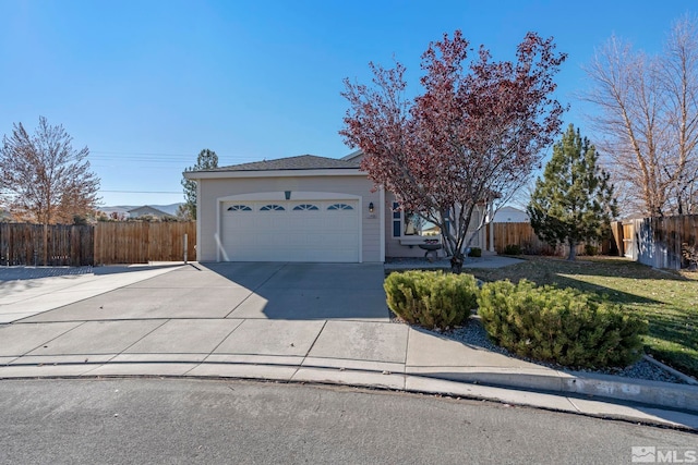 ranch-style home featuring a garage and a front lawn