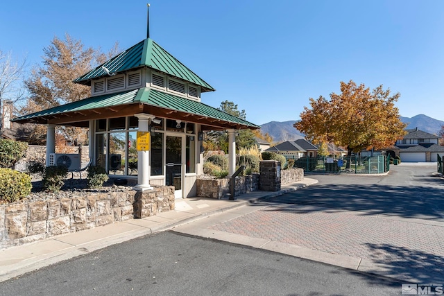 view of building exterior featuring a mountain view