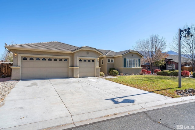 single story home featuring a garage and a front yard