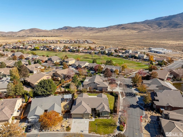 birds eye view of property featuring a mountain view