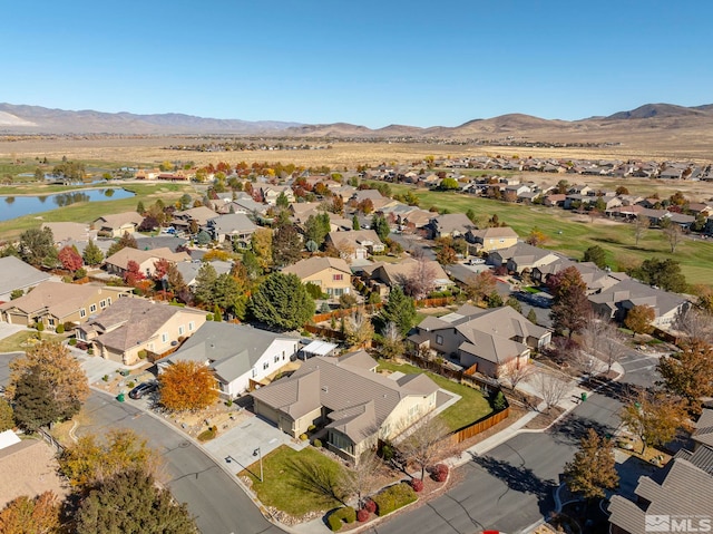 bird's eye view with a water and mountain view