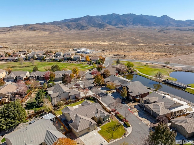 bird's eye view with a water and mountain view