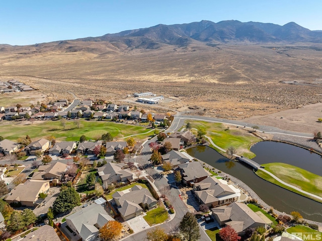 drone / aerial view with a water and mountain view