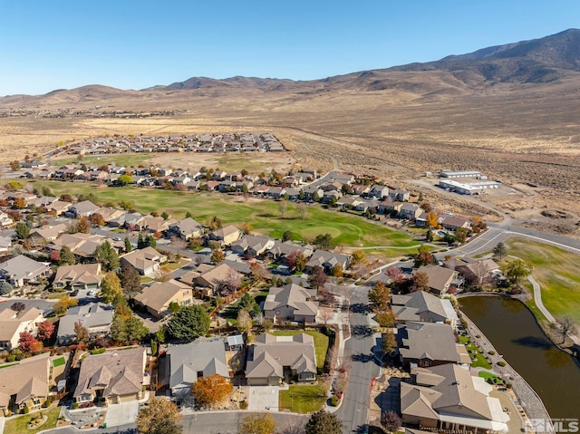 aerial view featuring a water and mountain view