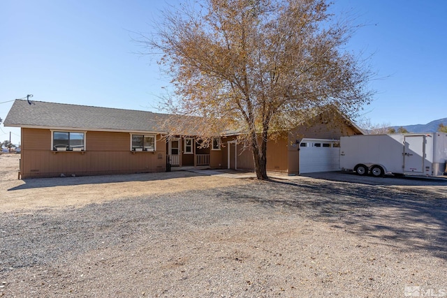 ranch-style house featuring a garage