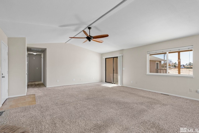 empty room with carpet floors, lofted ceiling, and ceiling fan