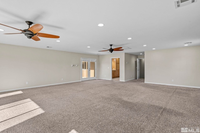 carpeted spare room with ceiling fan