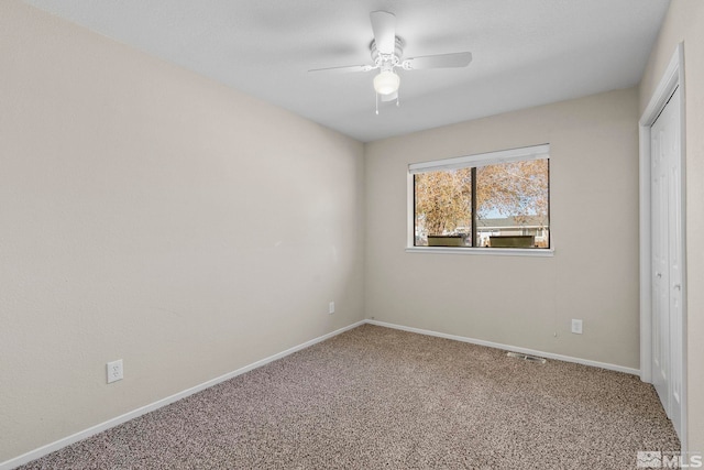 unfurnished bedroom with a closet, carpet flooring, and ceiling fan