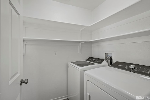 laundry room featuring washer and clothes dryer