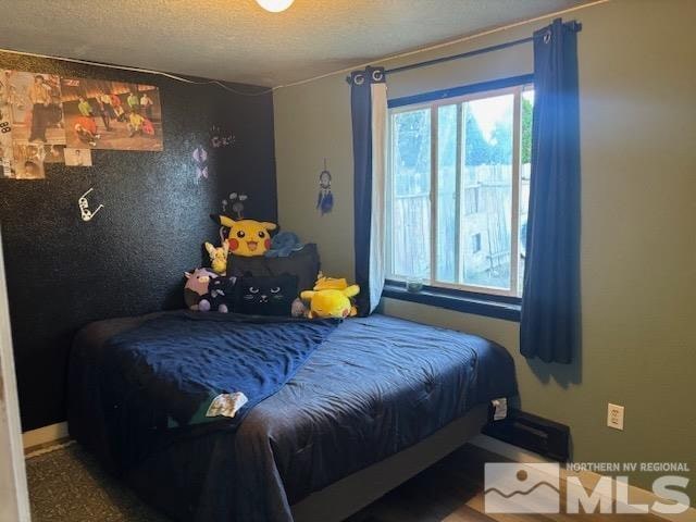 bedroom featuring a textured ceiling