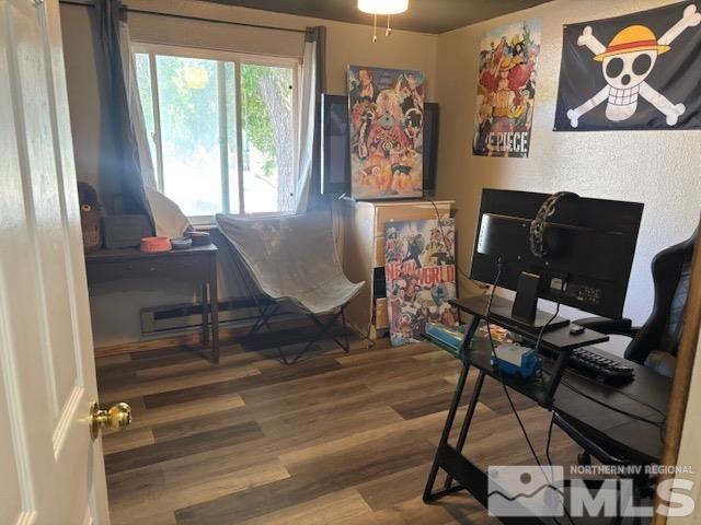 office space featuring wood-type flooring and ceiling fan