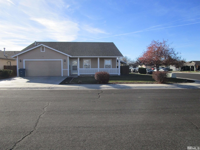 view of front of home with a garage and covered porch