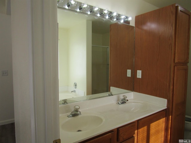 bathroom featuring vanity and separate shower and tub