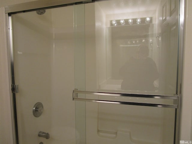 bathroom featuring enclosed tub / shower combo