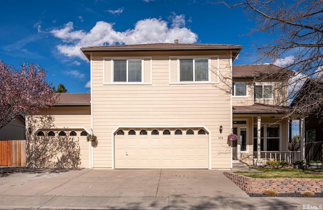 view of front property featuring a garage and a porch