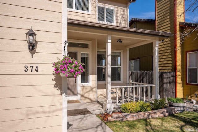 doorway to property featuring covered porch