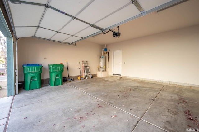 garage featuring a garage door opener and secured water heater