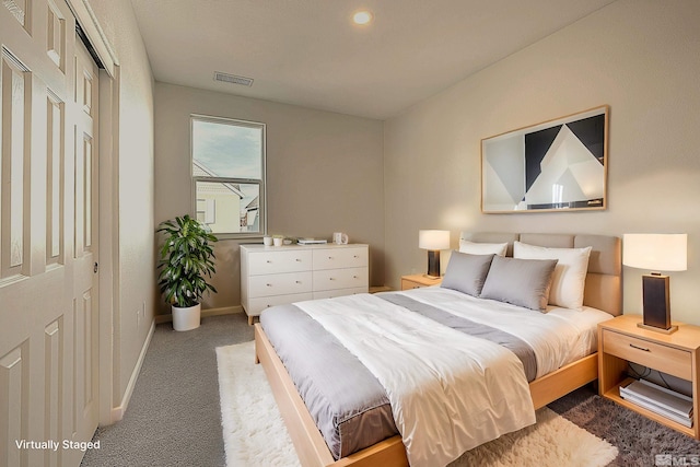 carpeted bedroom featuring a closet