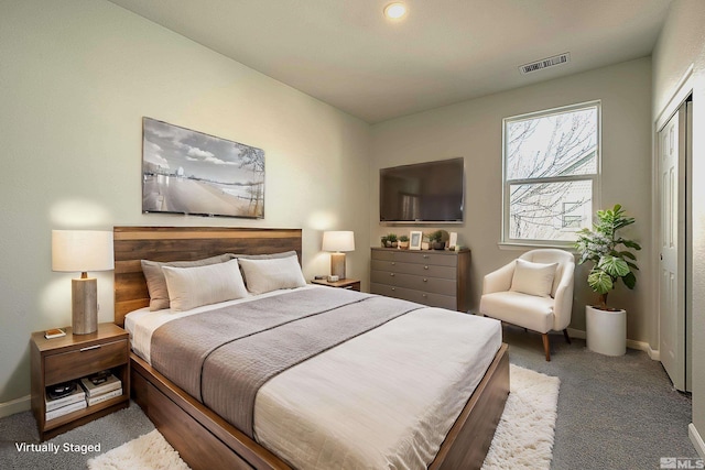 carpeted bedroom with a closet