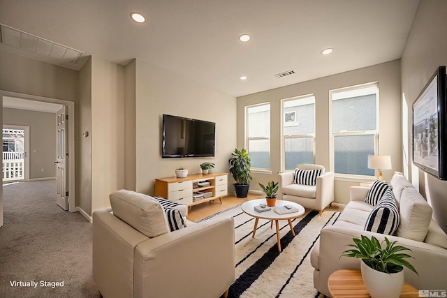 living room with light colored carpet