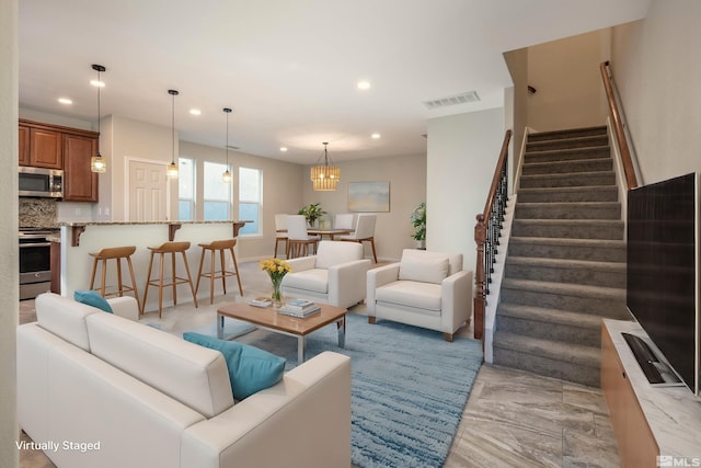 living room with a notable chandelier