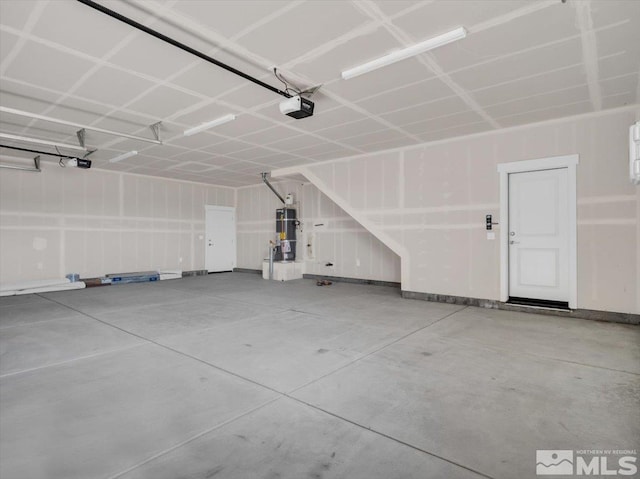 garage featuring secured water heater and a garage door opener