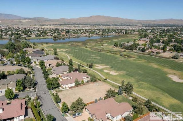 drone / aerial view with a water and mountain view