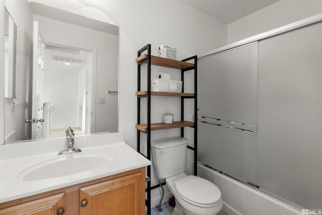 full bathroom featuring vanity, toilet, and enclosed tub / shower combo