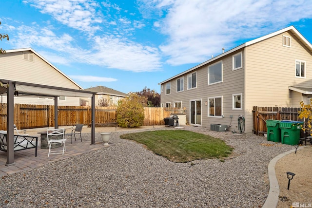 back of house featuring a yard and a patio area