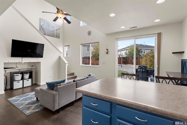 interior space with dark hardwood / wood-style floors and ceiling fan