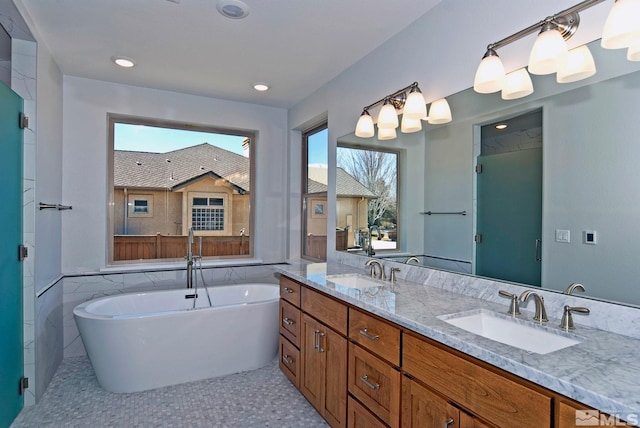 bathroom featuring vanity, independent shower and bath, and tile walls