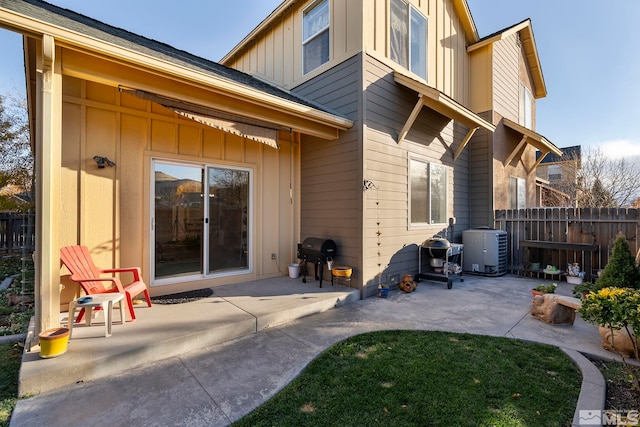 back of house featuring central AC and a patio area