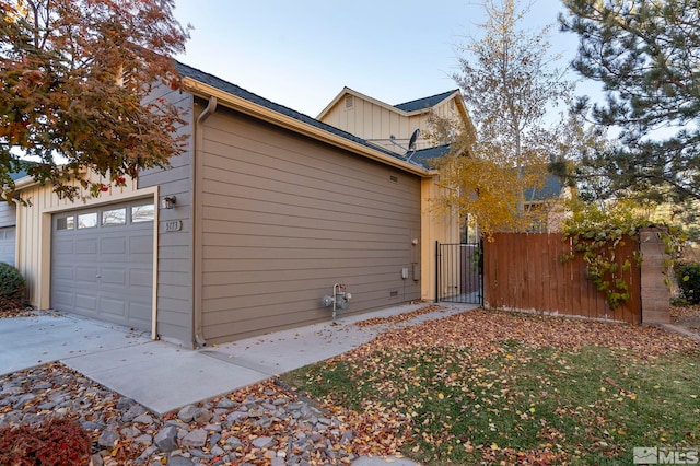 view of property exterior featuring a garage