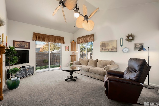 carpeted living room featuring ceiling fan and lofted ceiling