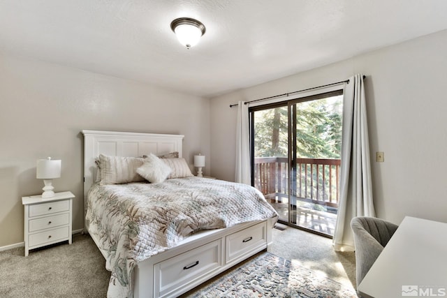 bedroom featuring access to exterior and light carpet