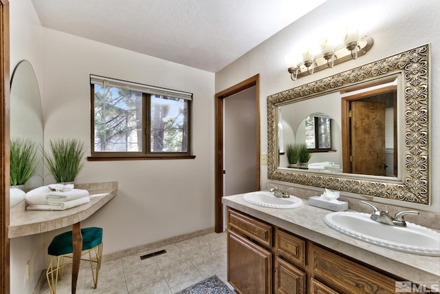 bathroom featuring vanity and tile patterned floors