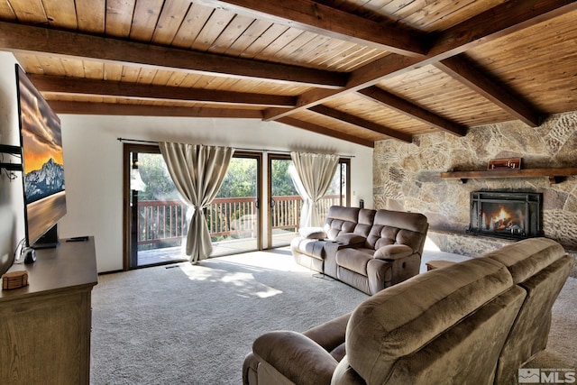 carpeted living room with a fireplace, vaulted ceiling with beams, and wood ceiling