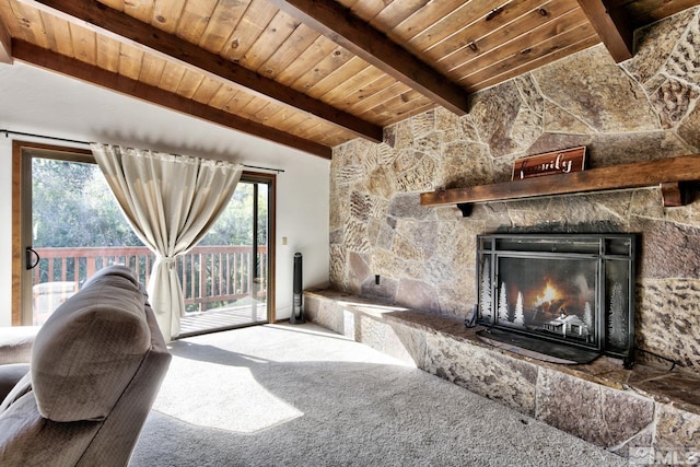 carpeted living room with a fireplace, lofted ceiling with beams, a wealth of natural light, and wood ceiling