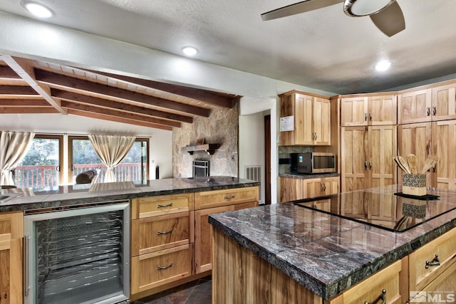 kitchen with a textured ceiling, black electric cooktop, beverage cooler, vaulted ceiling with beams, and a kitchen island