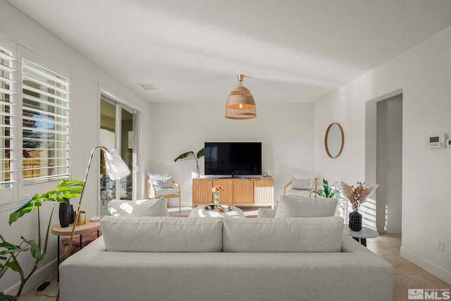 living room with light tile patterned floors