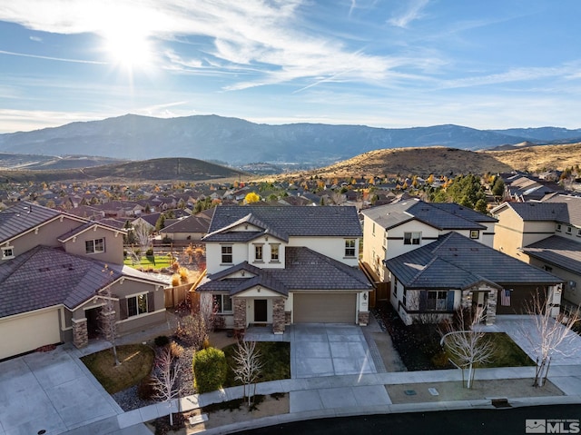 drone / aerial view featuring a mountain view