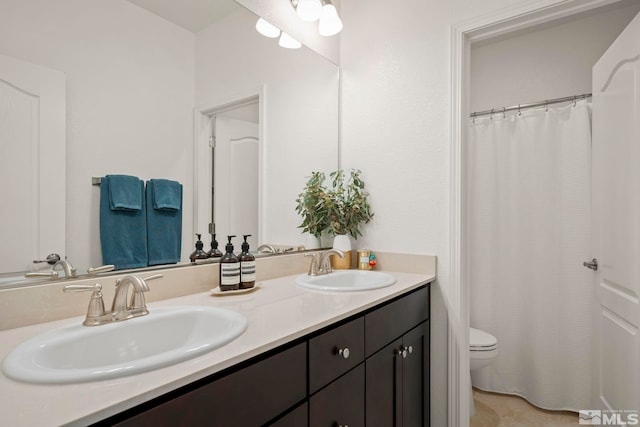 bathroom with vanity and toilet