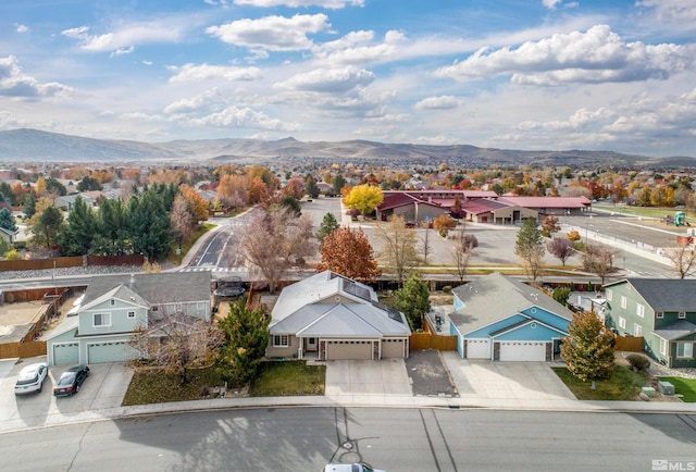 birds eye view of property with a mountain view