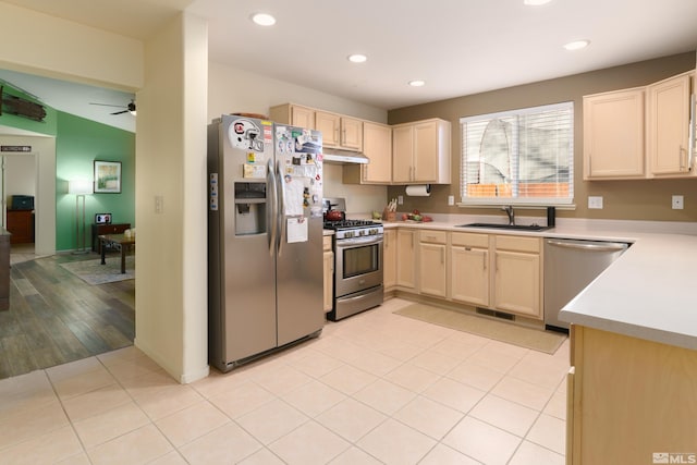 kitchen featuring light hardwood / wood-style flooring, sink, appliances with stainless steel finishes, light brown cabinetry, and ceiling fan