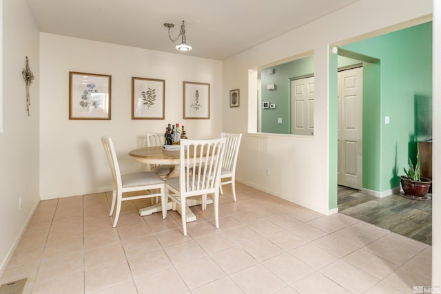 dining space with light hardwood / wood-style flooring